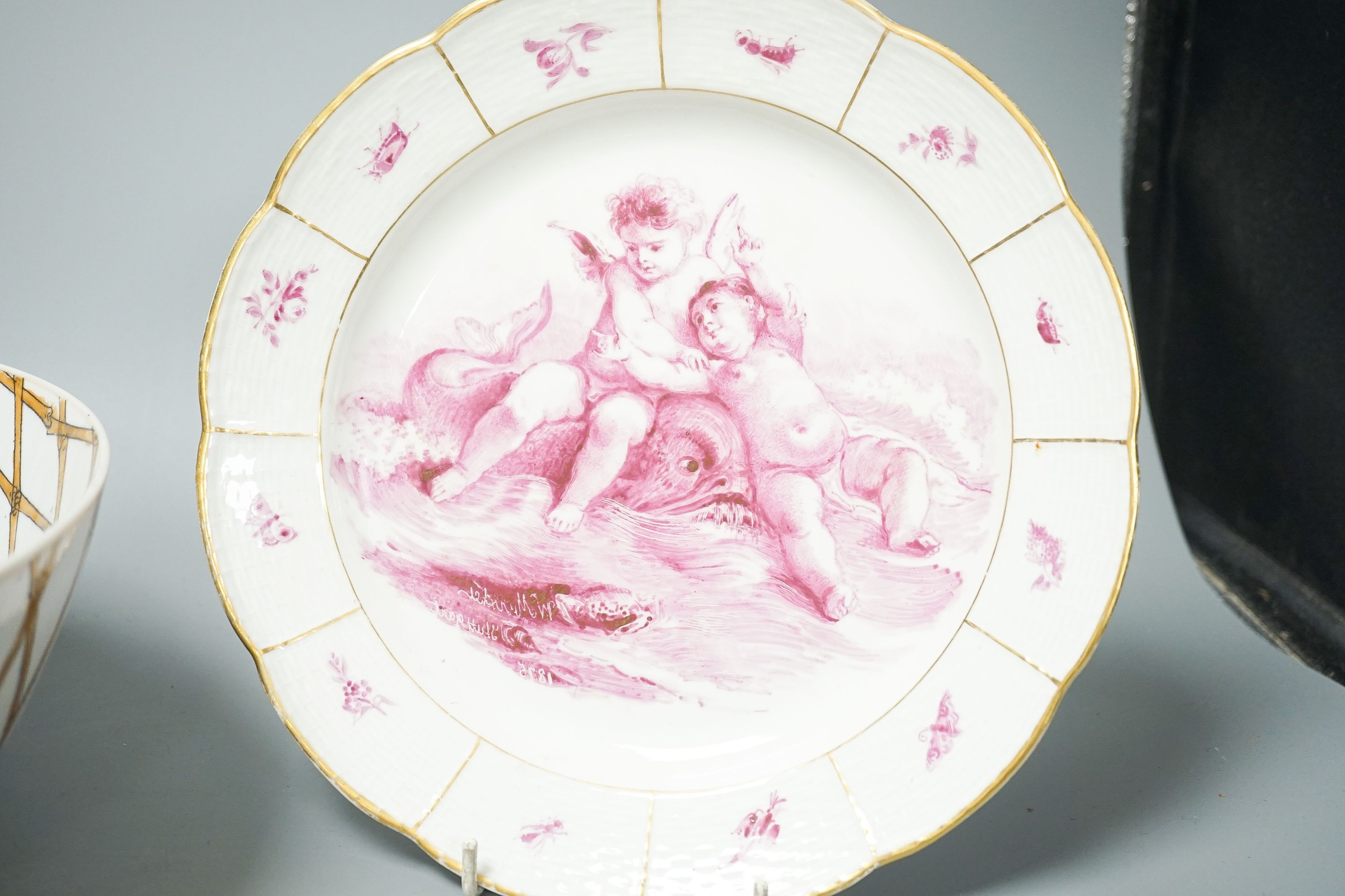 A Furstenburg dessert plate, later painted in puce, signed in reverse ‘W Munscher Stuttgart 1875’, 14.75cm an early 19th century Derby vase and a chinoiserie porcelain bowl (3)